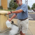 John filling water from Hot Springs