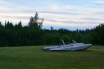 Plane pontoons by the river, after midnight