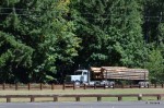 Logging trucks going