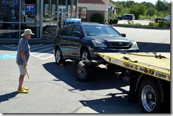 Tow truck lifting the car off the dolly